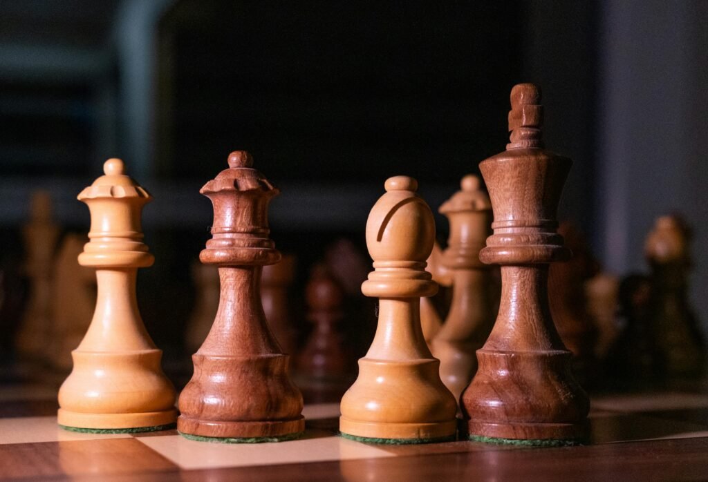 Detailed shot of wooden chess pieces on a board, highlighting strategy and focus.